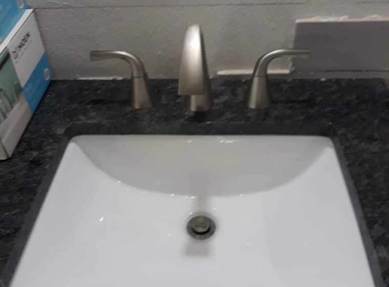 a newly installed bathroom fixture with marble top